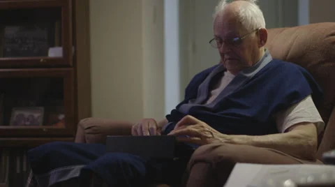 Elderly man on iPad in Robe Stock Footage 37345181