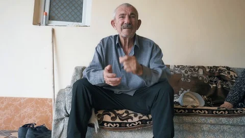Elderly man listens closeup Stock Footage 95679397