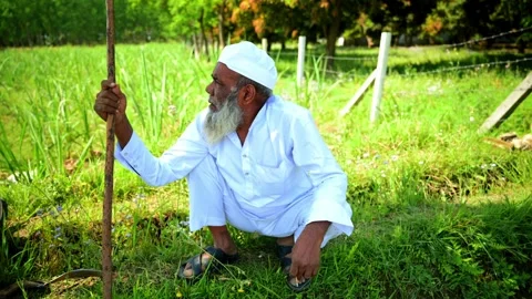 An Elderly Man with a Long Beard Cough While Smoking Stock Footage 293569591