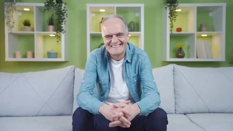 Elderly man looking at camera and laughing. Stock Footage 237794249