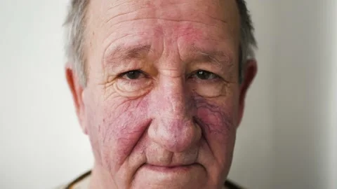 Elderly man looking at the camera, face close up 4K Stock Footage 147067554