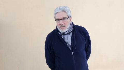 Elderly man looking at camera Stock Footage 71727209