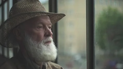 Elderly Man Looking Out Window Video stock 64146378