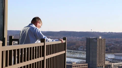 Elderly man looking over Cincinnati Stock Footage 36208064