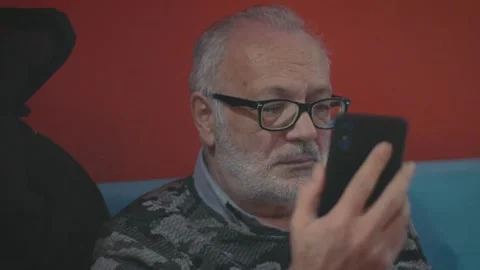 Elderly Man Looking at Phone Stock Footage 199668176