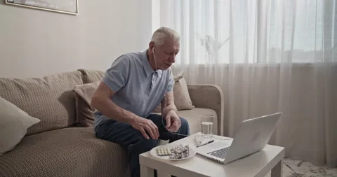 Elderly man making video call to doctor Stock Footage 196236404