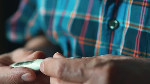 Elderly Man Measures Himself Temperature. In His Hands The Thermometer. 스톡 동영상 75492460