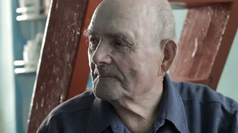 Elderly man observing a room Stock Footage 64622480