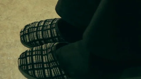 An elderly man in old slipers Stock Footage 69175940