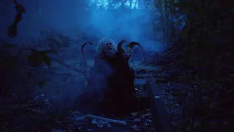 Elderly man performing witchcraft in the forest Stock Footage 283219569