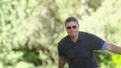Elderly man playing bocce ball Stock Footage 80133628