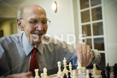 Elderly Man Playing Chess