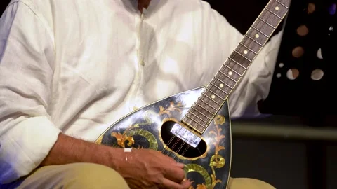 Elderly man plays mandolin during a live concert Stock Footage 136821575