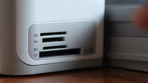 An Elderly Man Plugging SD Memory Flash Card Into A Slot Of Printer Stock-Footage 92703609