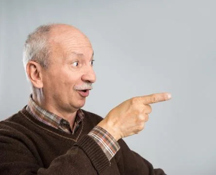 Elderly man pointing up Stock Photos