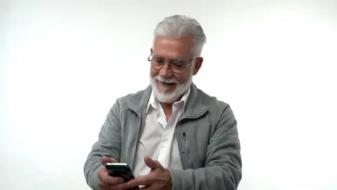 Elderly man pose with smartphone, read received sms with great commercial offer Stock Footage 222818527