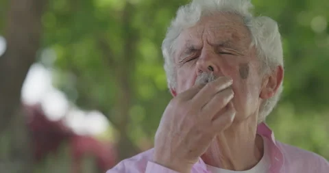 An Elderly Man Publicly Sharing Deep Emotions While Enjoying the Outdoors  Stock Footage 310661319