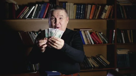 Elderly man pulls money out of wallet rich Stock Footage 148265988