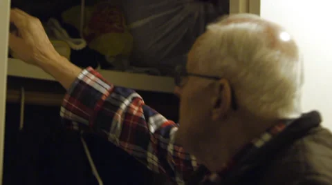 Elderly Man reaches for Hat Stock Footage 37345440