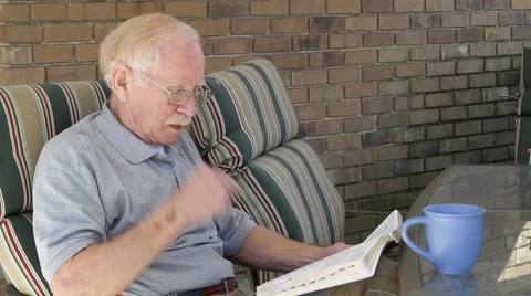 Elderly Man Reading Bible Stock Footage 1819444
