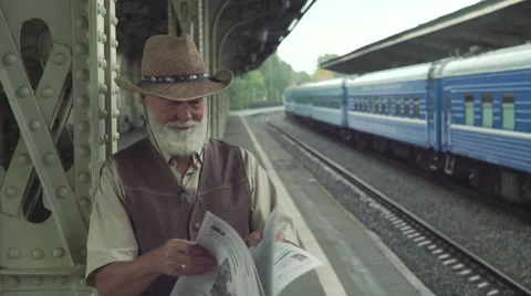 Elderly Man Reading Newspaper Stock Footage 64146401