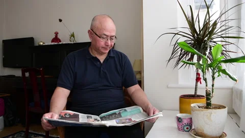 Elderly man reading the newspaper. Stock Footage 234611500