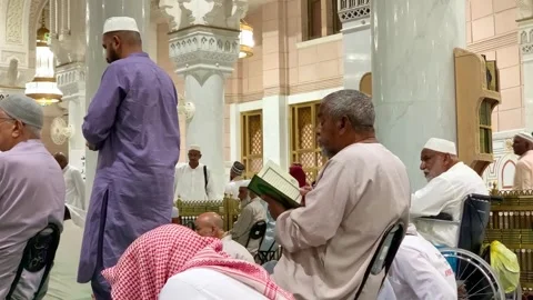 An elderly man reading the Quran Stock Footage 332593485