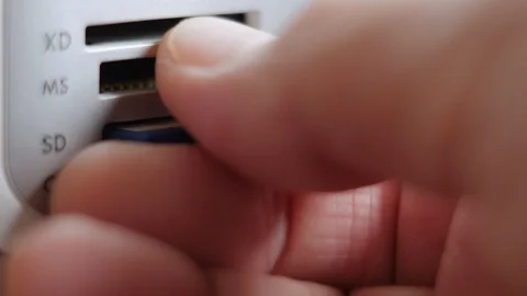 An Elderly Man Remove SD Memory Flash Card Into A Slot Of Printer Stock Footage 92703513