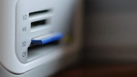 An Elderly Man Remove SD Memory Flash Card Into A Slot Of Printer Stock Footage 92703580