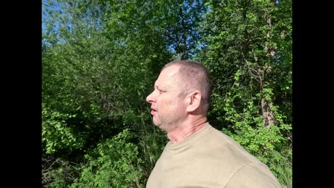 Elderly Man Running Through Forest Terrain. Stock Footage 310789084