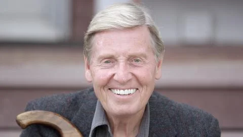 Elderly man smiling at camera Stock Photos