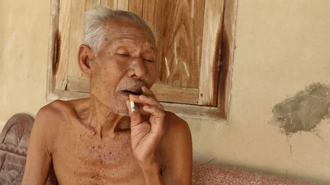 Elderly man smoking Stock Footage 73706760