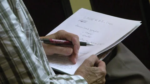 Elderly man taking notes CU hands pen paper  Vidéo 38673419