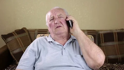 Elderly man talking on the phone Stock Footage 73720895