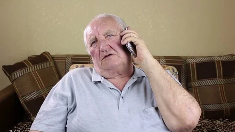 Elderly man talking on the phone Stock Footage 73721299