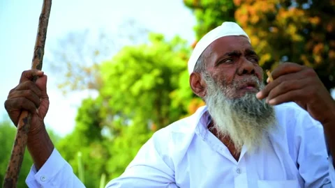 Elderly Man Talking While Sitting Outdoors Stock Footage 293569593