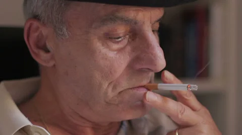 Elderly man thinking about problems and smokes a cigarette Stock Footage 32358037