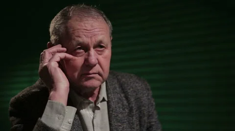 An elderly man thinks and feels sad Stock Footage 53267409