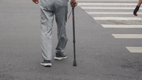 Elderly Man Using Crutch While Crossing Road,Beijing,China Stock Footage 340673901