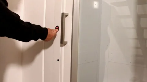 Elderly man using elevator in small old hotel Stock Footage 74456582