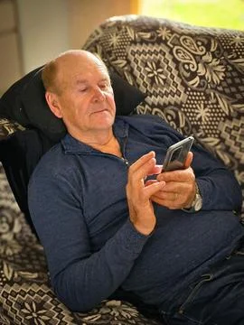 Elderly man using his cell phone Stock Photos