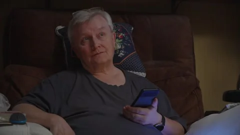 Elderly Man Using Smartphone on Couch at Home Stock-Footage 342837229