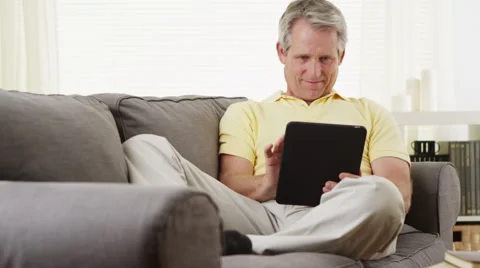 Elderly man using tablet smiling Stock-Footage 47538202