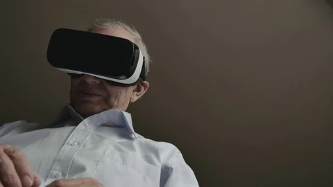Elderly Man Using Virtual Reality Headset Video stock 78416045