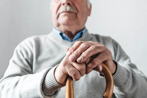 Elderly man with a walking cane Stock Photos