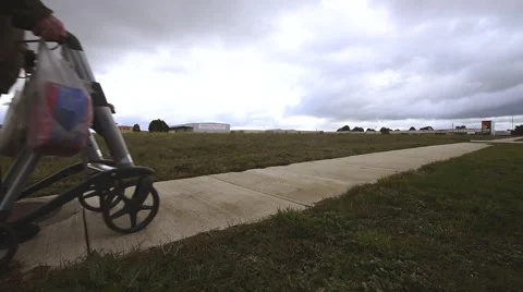Elderly man with walking frame on bleak winters day Video stock 53315276
