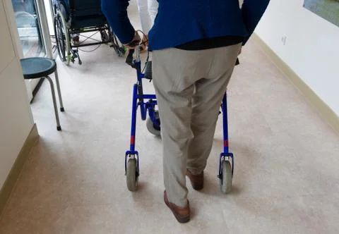 Elderly man with walking frame Foto stock