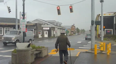 Elderly man Walking Through Town Video stock 5463573