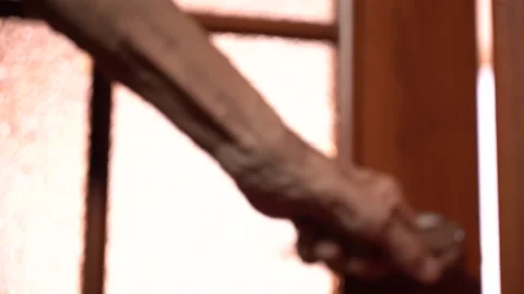 An Elderly Man's Hand Opens the Door to the Light Room Stock-Footage 156350045