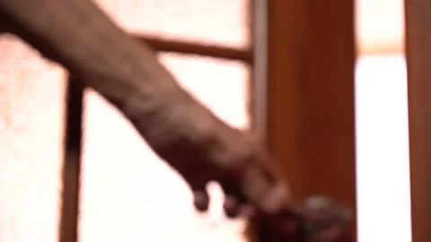 An Elderly Man's Hand Opens the Door to the Light Room Stock Footage 166997223